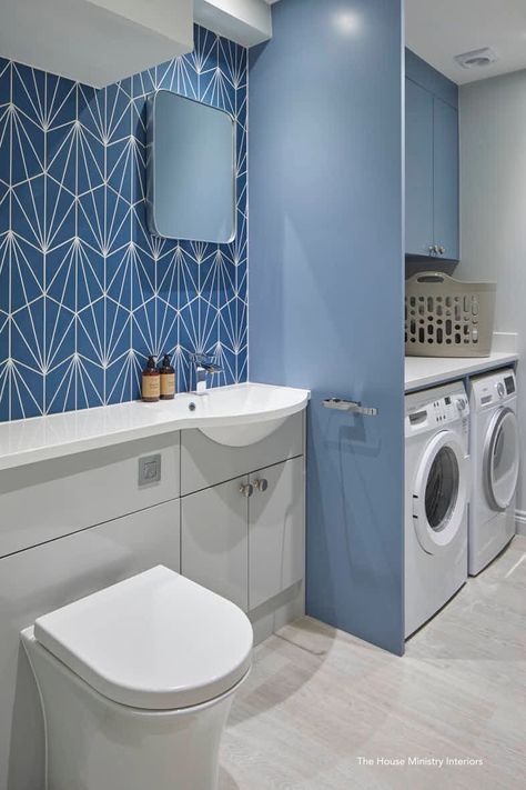 Combined Utility room with WC cloakroom.  Grey vanity unit cupboards, concealed WC with square flush plate.  A cast marble basin and countertop on the left hand side units.  White quartz countertop above the appliances.  The wall tiles are Mandarin Stone.  Karndean grey wood flooring. For more images of this project  https://www.thehouseministry.co.uk/stroud.html Bathroom And Washing Room, Utility With Shower Room, Utility And Shower Room Combined, Utility Cupboard In Bathroom, Shower Room And Utility, Laundry And Shower Room, Bathroom With Utility Room, Downstairs Toilet And Laundry Room, Downstairs Utility Room And Toilet