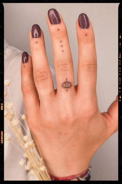 TATTOOS Mini Tats Cross, Dot Tattoos On Fingers Meaning, Small Tattoos Mandala, Cute Simple Tattoos For Women With Meaning, Lotus Tatoos Meaning, Dot Finger Tattoo Meaning, Finger Dots Tattoo, Womens Finger Tattoos Simple, Finger Dot Tattoo Meaning