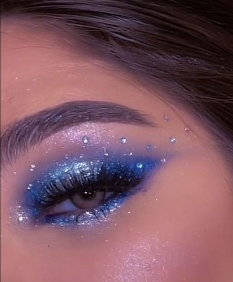 Light Blue Eye Makeup With Gems, Blue Eye Makeup 2023, Blue Chrome Makeup, Classy Blue Eye Makeup, Sapphire Tears Makeup, Sparkles Eye Makeup, Blue Eyeshadow Rhinestones, Blue Festival Makeup Glitter, Blue Rhinestone Eye Makeup