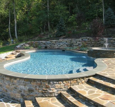 Above Ground Pool Brick Surround, Pool On Sloped Yard Retaining Walls, Tiered Backyard Ideas Sloped Yard With Pool, Partial Underground Pool, Semi Inground Pool With Bar, Pool In Sloped Backyard, Inground Pool Ideas Sloped Yard, Pool On A Hill Backyards, Pool Built Into Hillside