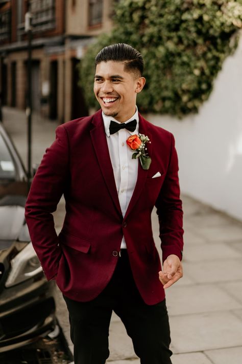 Groom in Burgundy Wedding Jacket with Pink Rose Buttonhole Wedding Suits Groom Wine Color, Mens Wedding Colors, Burgundy Suit Jacket Black Pants Men, Burgundy Dinner Jacket, Burgandy Wedding Suits Men, Red Wedding Groom Suit, Burgundy Suit Wedding Groom Attire, Christmas Wedding Mens Attire, Men’s Burgundy Suit