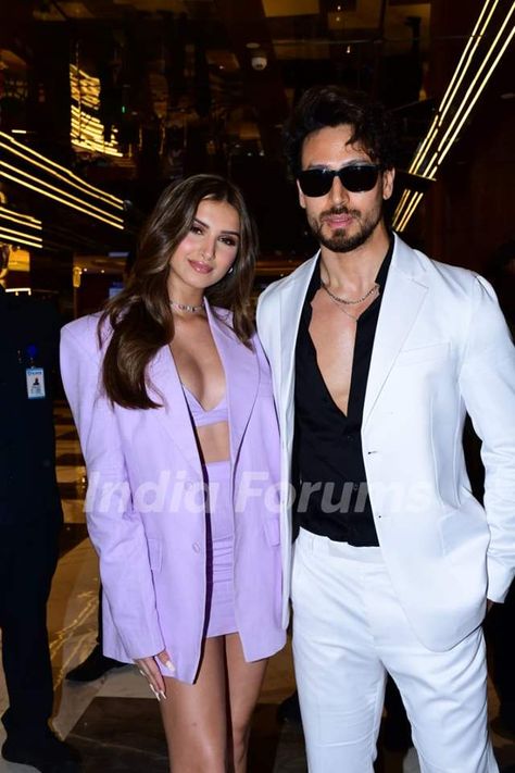 Tiger Shroff looks handsome in black shirt and white coat and trousers. Tara Sutaria raised the temperature in a three-piece lavender co-ord. Tara Sutaria, Short Blazer, Backless Blouse Designs, Tiger Shroff, Backless Blouse, How To Look Handsome, Shraddha Kapoor, White Coat, Blazer Dress