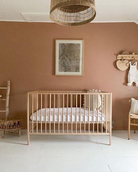 Beige Walls Nursery, Dark Pink Nursery Walls, Terra Cotta Nursery Ideas, Pink And Rust Nursery, Terra Cotta Nursery Color Schemes, Terracotta Nursery Accent Wall, Low Budget Nursery, Nursery Painted Wall, Painting Nursery