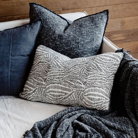 Create a harmonious home with the Hana Cushion. It features a striking jacquard pattern in black yarn that mimics the beauty of midnight, complemented by crisp off-white cotton and sophisticated Sora fabric piping.