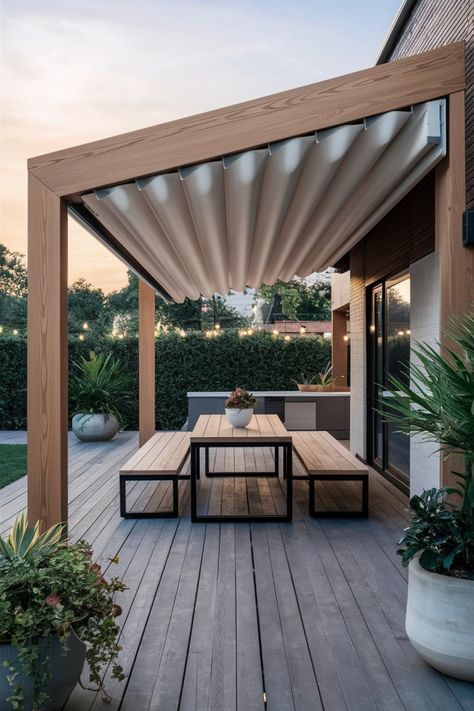 Upgrade your patio with a modern pergola designed for both style and function. The retractable canopy offers customizable shade, while minimalist furniture and potted plants create a serene, contemporary vibe. String lights enhance the ambiance, making it the perfect space for dining and evening gatherings.#ModernOutdoorDesign #FunctionalElegance #PatioDiningIdeas #RetractablePergola #OutdoorLightingDecor #NatureInspiredPatio Scandinavian Pergola, Pergola With Retractable Canopy, Modern Pergola Designs, Wood Restoration, Maximize Small Space, Retractable Pergola, Modern Pergola, Pergola Design, Retractable Canopy