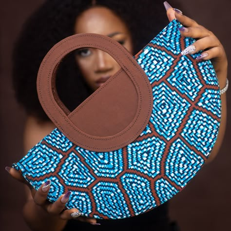 Brand Name: ModaBellaByFey First and Last Name: Feyisayo Agunbiade Short Bio: ModaBellaByFey is a Nigerian brand that prides itself in exploring the endless possibilities and versatility of African fabrics through our handmade bags, accessories and more. We are a youthful brand out to promote our love and passion for fashion, quality, and creativity. Email Address: info@modabellabyfey.com Mobile Number: 07732136753 Website: uk.modabellabyfey.com Full Instagram Handle: Modabellabyfey ... Arm Candies, Short Bio, Ankara Bags, Linen Bags, African American Fashion, Handmade Fabric Bags, African Wear Styles For Men, African Bag, Creative Bag