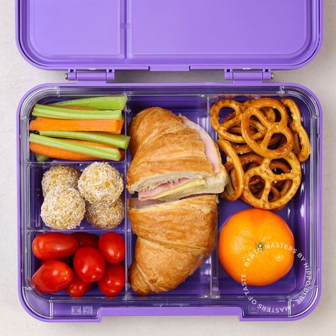 Unveiling our Bento Box of the week! 🏆🍱 Today's star is a scrumptious ham and cheese croissant 🥐 that's sure to make lunchtime the best time of the day. But that's not all! Fresh cherry tomatoes 🍅, crunchy carrot and celery sticks 🥕, some apricot bliss balls for a touch of sweetness 🍑, and of course, everyone's favourite - pretzels for a tasty crunch! 🥨 And what's a bento box without some fruity fun? We've added a mandarin 🍊 to give your kids that zesty burst of flavour and vitamin C. Bento Box Snacks For Kids, Thanksgiving Bento Box Ideas, Omie Box Lunch Ideas Kids, Lunch Box Snacks For Kids, Breakfast Bento Box Ideas, Bento Box Breakfast, Bento Box Ideas For Kids, Pack Lunch Ideas, Kids Lunch Box Ideas