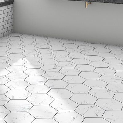 Meant to capture the appearance of marble, these tiles offers this timeless look in a durable, easy to maintain option. This hexagon shaped tile is perfect for any setting traditional enough for historical renovations or modern enough for new construction. It is available in forty-seven print variations that are randomly scattered throughout each case. This tile is durable and safe for heavy-duty interior and exterior locations including industrial applications. Tile is the better choice for you Tile Floor, Flooring