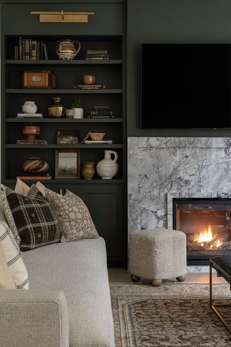 Shadow Avenue Living Room Revival | Ayesha Usman Design Closed Storage Living Room, Terrace Living Room Ideas, Moody Tv Room, Fireplace With Bookshelves On Each Side, Built In Shelves Living Room Fireplace, Fireplace With Bookshelves, House Basement, Living Room Mantle, Terrace Living Room