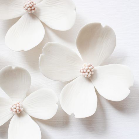 Pretty Dogwood Flowers for a Spring Look all year long! They are made from real biscuit white porcelain The mini-bead center is a delicate shiny pink. This decor includes 5 flowers whose sizes range from around 7cm to 10cm. 2.75in - 3.93in. They have two metal loops at the back for simple and quick hanging. If you have any questions feel free to reach out! See our collections on our website alaingranell.com    Please consider customs fees All our pieces are designed and handmade by ourselves in our french studio Flowers For Wall, Porcelain Decor, Pink Dogwood, Porcelain Earrings, Dogwood Flowers, Pottery Handbuilding, Hand Painted Earrings, Wax Flowers, Slab Pottery