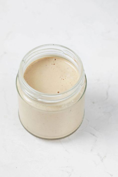 This balsamic Dijon tahini dressing is equal parts sweet and tangy—in a wonderful way! If you love a traditional balsamic vinaigrette, then you'll love this creamy alternative, which has the added bonus of nutrient density from sesame seeds. Tahini Dressing, Balsamic Vinaigrette, Tahini, Sesame Seeds, Dijon, If You Love, Love A, Spreads, Density