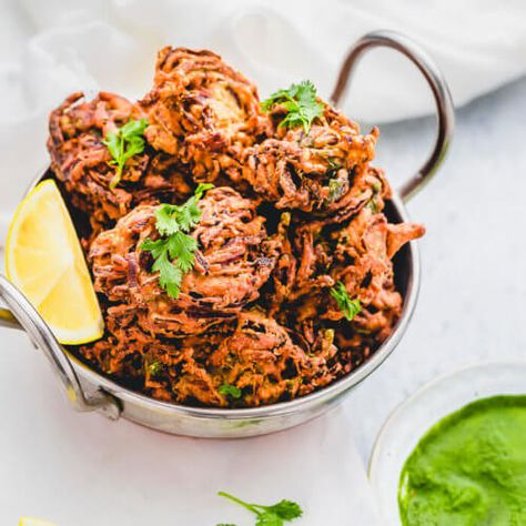 VEGAN Onion Bhajis are a delicious side to your favourite Indian curries. Learn to make Crispy Indian Onion Bhaji RECIPE with tips & tricks! Ready in 30 Min. Onion Bhaji Recipe, Indian Platter, Indian Starters, Onion Bhaji Recipes, Indian Sides, Onion Bhajis, Onion Bhaji, Indian Meals, Cooking Curry