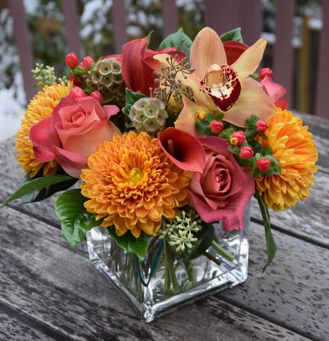 Flower arrangement with bright bold colored flowers (Coffee Break roses, disbud mums, cymbidium, dry scabiosa, hypericum, mini callas). Mini Flower Arrangements, Autumn Flower Arrangements, Broken Rose, Popular Shots, Kinds Of Flowers, Flowers Coffee, Fall Flower Arrangements, Home Floral Arrangements, Flower Vase Arrangements