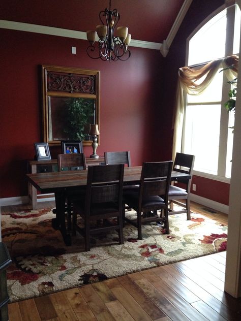 Formal dining room with sherwin Williams barn red paint. Red Dining Room Walls, Dark Red Dining Room, Maroon Kitchen Walls, Dark Red Accent Wall, Burgundy Hallway, Maroon Dining Room, Red Dining Room Ideas, Wayne Scotting Walls, Burgundy Dining Room