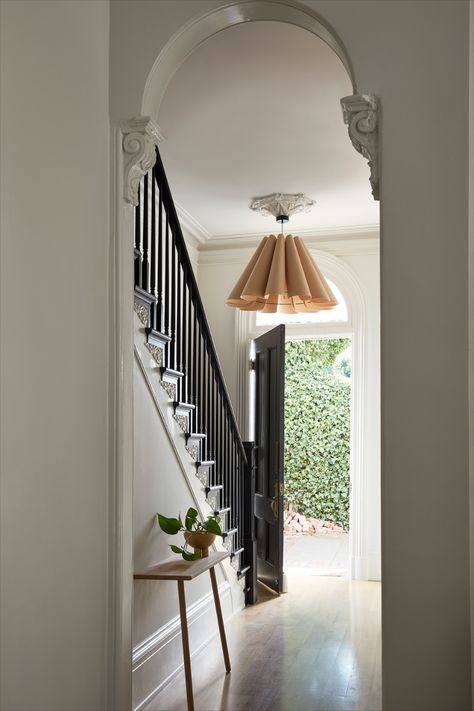 DESIGN | NgLp Designs shares an Old Victorian home renovation with before and after design — "A clean black and white palette greets you as you as the enter the front door. We had to restore the staircase, recreating a period appropriate newel post and bannister as well as recreating a historically accurate plaster ceiling medallion. The oversized pendant offers the air of grandeur this house demands." / architecture, interior design, interior decor, home tour / #home #renovation #blackandwhite Elsie Green, Custom Dining Tables, San Francisco Houses, Real Kitchen, California Living, Statement Lighting, Entry Way, Ceiling Medallions, Ceiling Decor