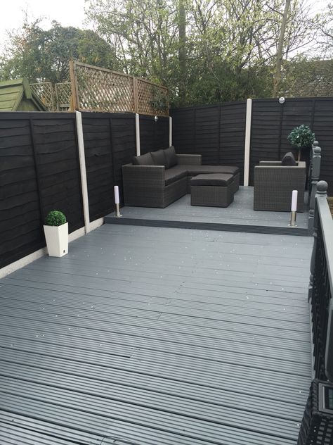 Grey decking and planters Grey Fence And Decking, Decking And Fence Colour Ideas, Black And Grey Garden Ideas, Dark Grey Decking Ideas, Grey Decking Ideas Garden, Grey Garden Ideas, Grey Decking Ideas, Grassless Garden, Decking Colours Ideas