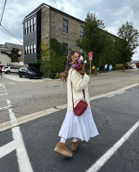 fall maxi skirt outfit rory gilmore sweater platform mini uggs inspo flower boquet brown paper inspo autumn vibes Long Dress And Uggs Outfit, Ugg Spring Outfit, Maxi Skirt And Sweater Outfit Fall, Ugg Tasman Skirt Outfit, Uggs With Skirt Outfit, Ugg And Skirt Outfit, Uggs Dress Outfit, Modest Mini Skirt Outfit, Cozy Skirt Outfits