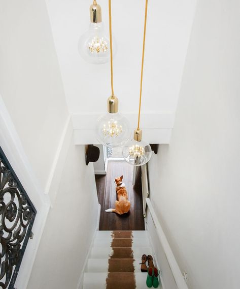 23 hallway lighting ideas – stylish ways brighten your hallway | Real Homes Hallway Lighting Ideas, Edison Light, Cage Pendant Light, Pendant Lamp Design, Hallway Designs, Edison Lighting, Wall Art Lighting, Art Deco Chandelier, Hallway Lighting