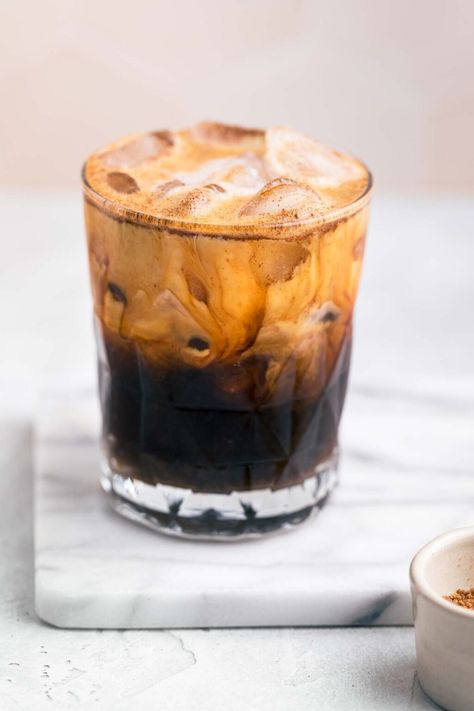 This Starbucks copycat Iced Brown Sugar Shaken Espresso is an iced coffee drink that combines ice, espresso, brown sugar, and oat milk with a hint of cinnamon. The perfect summer coffee drink! #starbucks #icedcoffee #IcedBrownSugarShakenEspresso #dairyfree #summercoffee Brown Sugar Shaken Espresso Starbucks, Iced Brown Sugar Shaken Espresso, Shaken Espresso Starbucks, Brown Sugar Shaken Espresso, Summer Coffee Drinks, Shaken Espresso, Drink Starbucks, Make Brown Sugar, Espresso Recipes