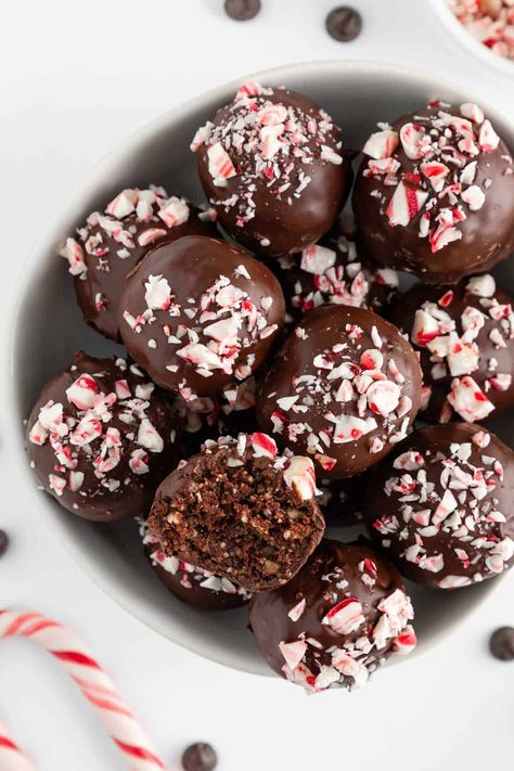 Chocolate peppermint truffles are a no bake dessert for Christmas! They’re vegan, gluten-free, fudgy, and easy to make. Made with healthy ingredients like dates, almonds, cocoa, peppermint extract, and dark chocolate. Topped with crushed candy canes and perfect for the holiday season! #peppermint #truffles #nobakedesserts #energyballs #energybites #vegandessert #vegandessertrecipes #holidaydesserts #christmasdesserts #christmasrecipes #holidayrecipe #candycanes Chocolate Peppermint Truffles, Peppermint Frosting, No Bake Truffles, Chocolate Peppermint Cake, Peppermint Truffles, Crushed Peppermint, Peppermint Cake, Mocha Cake, Peppermint Candies