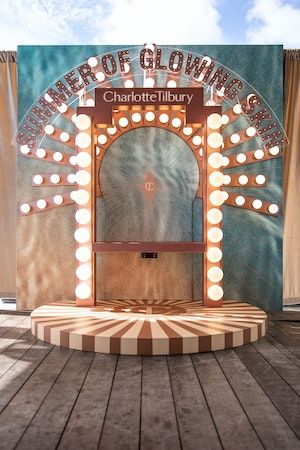 Charlotte Tilbury Summer Launch Party at Mondrian South Beach | 49 more photos on PartySlate Photo Activation, Broadway Theme, 70s Disco Party, Selfie Wall, Mall Decor, Beauty Advertising, Window Display Design, Beauty Salon Decor, Circus Theme