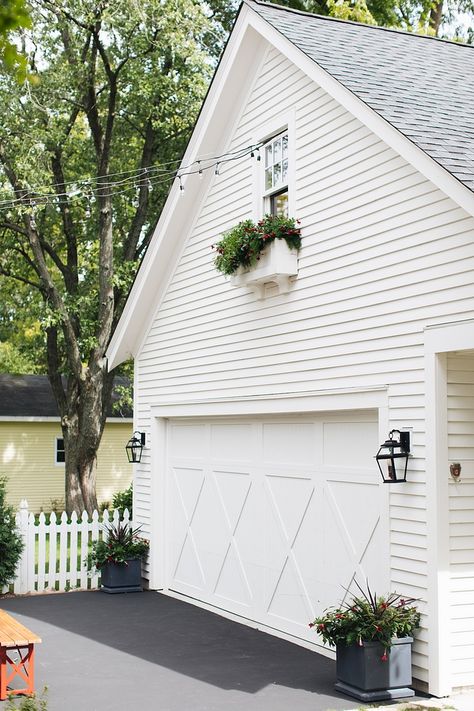 Benjamin Moore White Dove siding House and detached garage are painted Benjamin Moore White Dove #BenjaminMooreWhiteDove Detached Garage Paint Colors, House Apron Exterior, White House White Garage Door, White Detached Garage, Bm White Dove Exterior, Benjamin Moore White Dove Exterior, White Dove Exterior Paint, Home Exterior Landscaping, White Dove Exterior