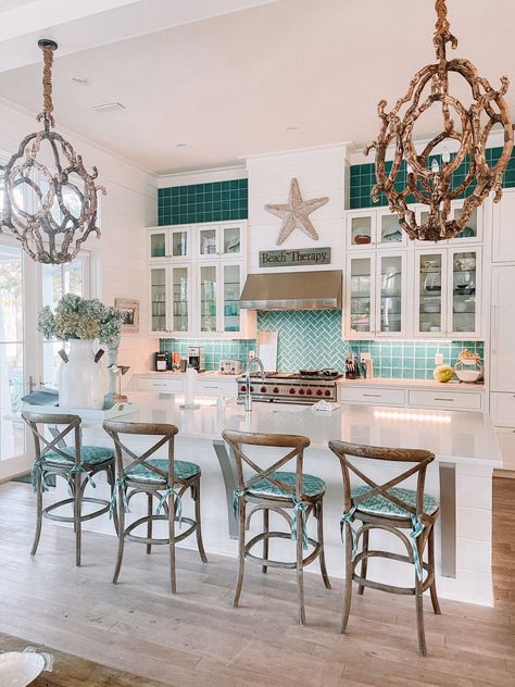 I thought it might be fun to give a tour of the beach house interior we are staying in. I love all of the shades of aqua and blue mixed with bright and airy whites and neutrals. It really does feel restful and inviting, perfect for vacation.