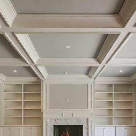 Ariella Horowitz on Instagram: "Built ins and a coffered ceiling for the family room #familyroom #trimwork #builtins #ceilingdesign #cofferedceiling #classic #timeless #transitionaldesign #hamptonsstyle #fireplace #marblesurround #naturallight #hardwoodfloors #designer #designideas #interiordesign #homebuilder #newconstruction #bergencounty #njrealestate #hgtv #luxuryliving #luxuryhomes #the_real_houses_of_ig  #inspire_me_home_decor #oakdriveproject" Coffered Ceiling Ideas Living Room Wood, Great Room With Coffered Ceiling, Living Room With Coffered Ceiling, Modern Coffered Ceiling Design, Coffered Ceiling With Fireplace, Coffered Ceiling Open Floor Plan, Simple Coffered Ceiling, Ceiling Square Design, Coffered Ceiling Basement