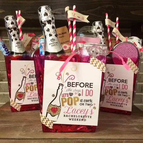 Before she says I do - let's pop a cork or two! Custom Bachelorette survival kits, created for a weekend getaway. Contents: mini bottle of champagne, compact mirror, tylenol, band aids, hair ties, bobby pins, mints and more. Perfect goodie bags for a girls trip! Hen Party Ideas Goodie Bags, Hen Weekend Ideas Goodie Bags, Hens Party Goodie Bags, Hens Party Gift Bags, Hen Party Bags What To Put In, Hen Do Goodie Bag Ideas, Bach Party Survival Kits, Survival Kit Bachelorette Party, Hen Party Gift Bags