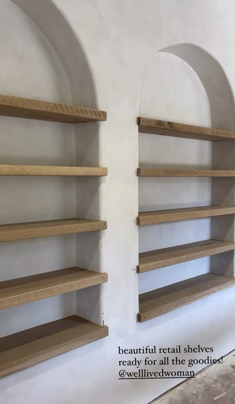 Adobe Built In Shelves, Floating Retail Shelves, Arched Floating Shelves, Shelves Between Columns, Arch Bookcase Diy, Wall Cutout Between Rooms, Drywall Niche, Small Salon Decor, Built In Wall Shelves