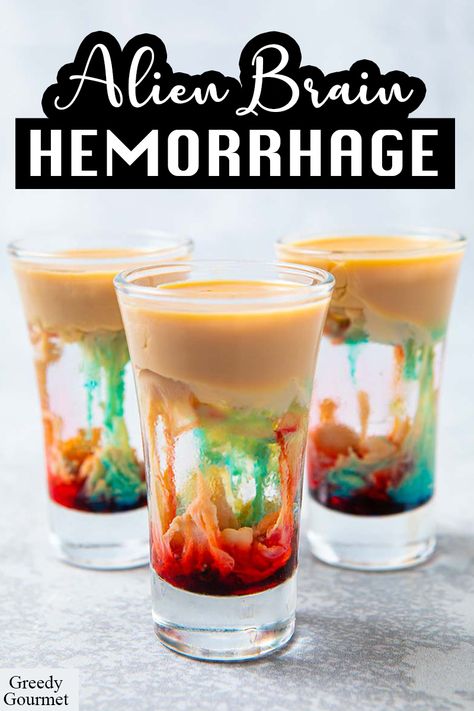 The Alien Brain Hemorrhage is perfect for those who likes their drink to have a grim and grisly perfection. There are only four ingredients to make this shot- Bailey’s, blue curaçao, grenadine and peach schnapps. It looks gruesome inside, but it tastes so good. This shot is quick and simple to make. Click this pin now to know how to make this Halloween-themed shot! #alienbrainhemorrhage#halloweenshot#halloweendrinks#cocktail#cocktailrecipes#drink#drinkspecials#liquor Coktail Halloween, Toblerone Cocktail, Drinks Com Vodka, Halloween Shots, Halloween Party Drinks, Recetas Halloween, Halloween Drinks Alcohol, Halloween Drink, Halloween Fest