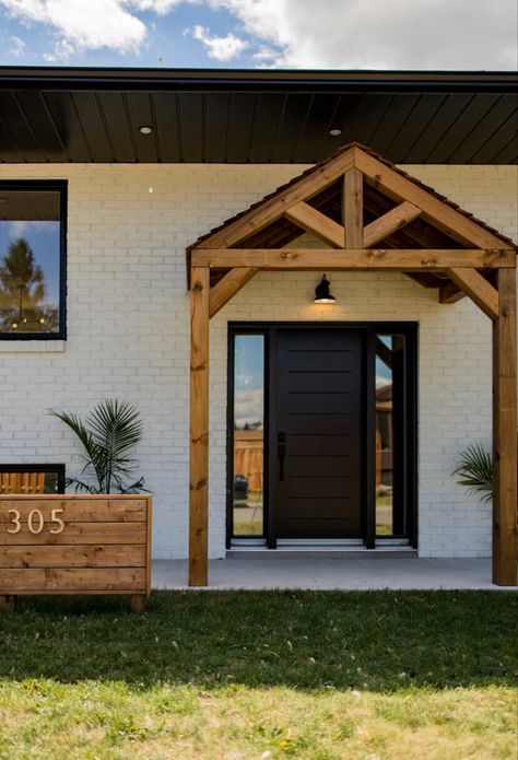 Black Front Door With Wood Beams, Wood Awning Over Door Front Door, Adding Wood Beams To Front Porch, Ski Chalet Front Door, A Frame Front Door, Front Door Awnings Entrance House, Front Door Roof Ideas Entrance, Timber Porch Ideas, Wood Awning Over Door