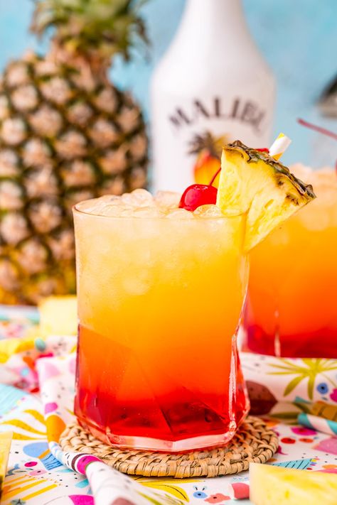 Malibu Sunset Drink is a tropical cocktail made with pineapple juice, coconut rum, and homemade grenadine syrup for the perfect summer drink! Malibu Sunset Cocktail Recipe, Sunset Drink Recipe, Summer Beach Drinks, Drinks With Grenadine, Sunset Cocktail Recipe, Homemade Grenadine, Pool Snacks, Rum Drinks Recipes, Malibu Drinks