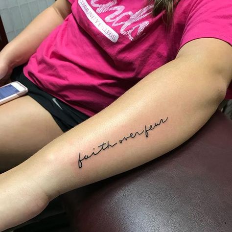 32 Best Faith Over Fear Tattoo Ideas  15 Faith Over Fear Tattoo Ideas, Fear Tattoo Ideas, Faith Over Fear Tattoo, Name Tattoos On Arm, Fear Tattoo, First Time Tattoos, Side Arm Tattoos, Tattoo Over Scar, Cursive Tattoos