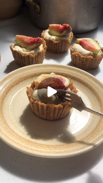 Eleanor Cripps on Instagram: "Gingernut & fresh fig tarts with honey mascarpone 🍯 

For the tart pastry:
150g gingernut biscuits (about 2/3 pack)
50g melted butter
2 tbsp water

For the filling:
1 cup mascarpone or thickened cream
1 heaped tbsp runny honey or maple
Fresh figs to decorate

Break the gingernut biscuits into pieces, then process in a food processor or blender until the mixture resembles fine breadcrumbs. Transfer to a bowl, then stir in the melted butter and water. Press the mixture into muffin tins lined with paper cases to create a mini tart shell. Pop in the fridge or freezer to set for at least an hour. 

Stir together the mascarpone and honey, then dollop into each tart case. Top with slices of fresh figs. 

Makes 6 mini tarts (best stored in the fridge, and eaten on th Fig Tarts, Frozen Tart Shells, Honey Mascarpone, Tart Pastry, Mini Tart Shells, Thickened Cream, Fig Tart, Mini Tarts, Ginger Nut