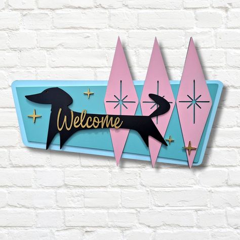 Add a touch of Mid Century Modern art to your home with this beautifully Handmade Wood Welcome Sign. The design features an atomic starburst design that perfectly captures the essence of the 50s and 60s era. Measuring approximately 17 inches in width, 10 inches in height, and 3\4 inch in depth, this MCM Sign looks fantastic on any front door or entryway.  This Retro Welcome Sign is made of high-quality wood, and Hand painted with care. The natural  coloring varies slightly from piece to piece, making each sign unique. The hanger is included and attached on the back for easy wall hanging.  The MCM Sign is a beautiful and unique way to welcome guests to your home or business. Its timeless design and quality materials ensure it will last you for years to come. The sign is shipped with great c Mid Century Modern Trailer, Mid Century Modern Stencils, Mid Century Motel, Mid Century Modern Prints, Mcm Front Door, Mid Century Modern Art Diy, Mid Century Art Painting, Mcm Diy, Midcentury Modern Interior Design