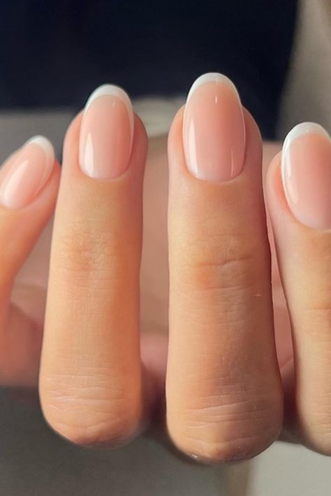 Timeless elegance in a manicure! The nails are crafted with a soft almond shape, featuring a classic French tip that's flawlessly executed with crisp white borders. The nude base complements the white perfectly, creating a sleek and sophisticated look suitable for any occasion. Perfect for those who appreciate a chic, refined style.  // Photo Credit: Instagram @nailhousebydiana Classic Short Almond Nails, Classic Squoval Nails, French Nails Ideas Oval, French Tip Gel Manicure Natural Nails, Clear Wedding Nails, Manicure Ideas Almond Shape, French American Nails Natural, Neutral Color French Tip Nails, French Type Nails