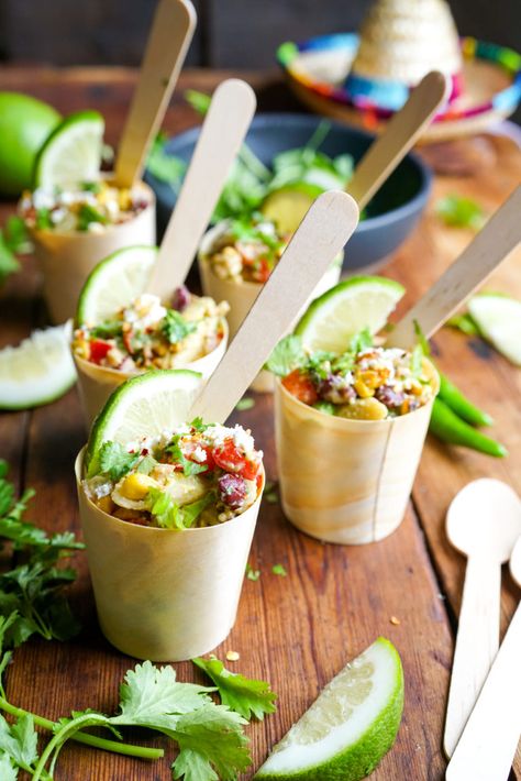 A delicious Mexican Street Corn Pasta Salad in bamboo cups makes for a perfect party food - neat, delectable and in bio-degradeable packaging! Grab the ultimate Mexican Street Corn Pasta Salad recipe right here! #partyfood #partysalad Small Salads Cups, Pasta Salad In A Cup, Mini Pasta Cups, Mexican Charcuterie Cups, Boating Appetizers, Individual Salads For Parties, Party Food In Cups, Individual Appetizers In A Cup, Mexican Charcuterie