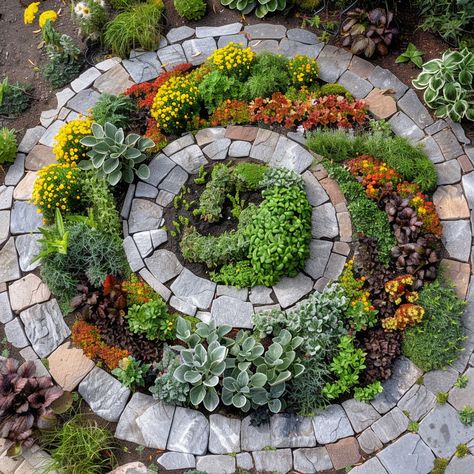 🌿🌈 Spiral Herb Garden with Colorful Culinary Herbs! 🌟✨ This innovative garden design features a spiral structure that maximizes space and provides optimal growing conditions for a variety of culinary herbs. The spiral shape creates different microclimates, allowing you to grow a diverse range of colorful and fragrant herbs in a compact area.🍃 Circular Herb Garden, Spiral Garden Bed, Herb Circle Garden, Spiral Flower Bed, Spiral Garden Design, Herb Spiral Garden, Round Garden Bed, Circular Garden Design, Heritage Garden