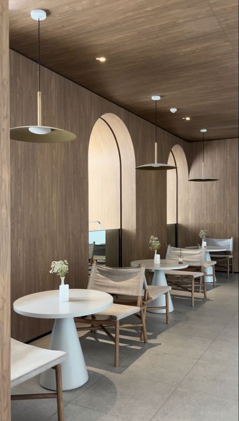 Minimalistic Restaurant Interior, Minimalistic Cafe Exterior, Beige Cafe Interior, Light Cafe Aesthetic, Minimal Cafe Design Interiors, Beige Restaurant, Coffee Shop Chairs And Tables, Neutral Bakery Aesthetic, Neutral Cafe Interior