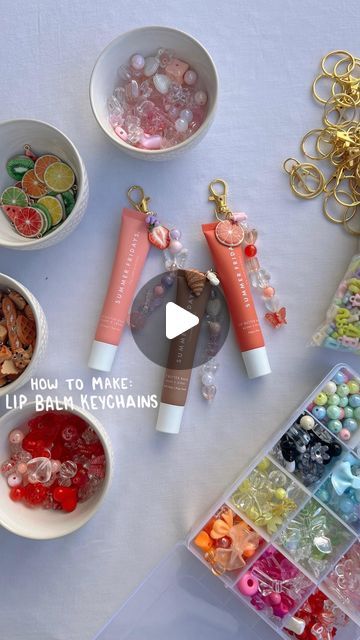 Maxie Huez | Lifestyle, Fashion & Beauty | on Instagram: "Saw @j.xnah make these and had to try with all of the lippies 🪸🌞 comment LB1 if you want the link to detailed instructions & the items I used to make lip balm keychains 🩷  #crafts #craftideas #girlsnightin #aesthetic #amazon crafty, diy, crafting, asmr, gift ideas, affordable gift ideas, cute gifts, cute crafts, diy keychain, cute keychain, cute charms, amazon crafts, amazon craft finds, amazon must haves,  crafts with friends, crafts for summer, diy crafts, lip gloss keychains, how to make lip balm keychains, summer ideas" Kawaii, Diy Gift Sets To Sell, Summer Fridays Lip Balm Keychain, Lip Gloss Keychain Ideas, Summer Fridays Keychain, Lip Gloss Charm Diy, Lip Balm Charm Keychain, Summer Crafts With Friends, Lip Balm Charm