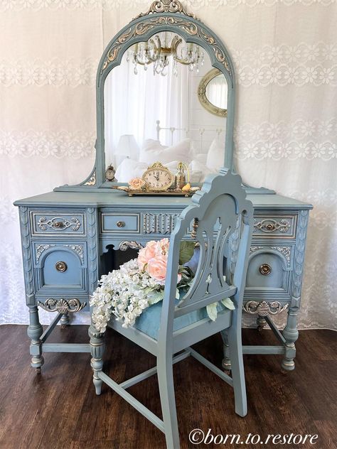 This gorgeous antique vanity is hand painted in a lovely dusty blue, sealed and highlighted with a soft gold.  It has a glamorous finish with a slight vintage look.  The five dovetail drawers are very well built, the hardware are original  The beautiful to the piece . The original mirror is aged with the characteristic of an antique mirror that is 92 years old with some small blemished just enough to give the mirror true charm while no detracting from your everyday use and add character.   The b Antique Vanity Makeover, Lace Painted Furniture, Fancy Vanity, Ethereal Room, Pretty Mirrors, 1950 House, Princess Vanity, Unique Vanity, Vanity Vintage