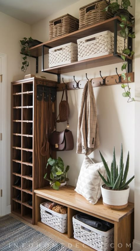 Discover how to transform your small entryway into a functional yet stylish space! This entryway features a tall wooden shoe rack with cubbies, stylish floating shelves adorned with decorative baskets, and wall-mounted hooks perfect for jackets or bags. The combination of warm wood tones and sleek metal accents creates an inviting atmosphere, enhanced by natural light. A few potted plants add a refreshing touch to complete this smart storage solution. Elevate your entryway decor with these practical ideas! #EntrywayStorage #SmallEntrywayIdeas #Entryway Entry Hallway Shoe Storage, Small Hall Shoe Storage Ideas, Jacket Rack Entryway, Shoe Storage In Small Spaces, Coat Rack With Baskets, Front Entryway Coat Hooks, Front Door Shoe And Coat Storage, Shoe Rack Coat Rack, Shoe Pegs On Wall