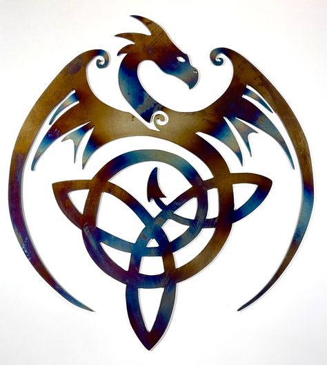 CNC Plasma cut metal wall art: Gorgeous flying dragon with Celtic knot in tail. Cut from 14 gauge mild steel, heat treated to color, with powder coat finish. Measures 14x12 inches. Color may vary due to heat treating process. Great decoration for living room, den, garage, bedroom, or any space. Makes for a unique and stunning gift. Celtic Dragon Drawing, Dragon Celtic, Dragon Silhouette, Alchemy Art, Dragon Tattoo For Women, Garage Bedroom, Flying Dragon, Celtic Dragon, Fantasy Props