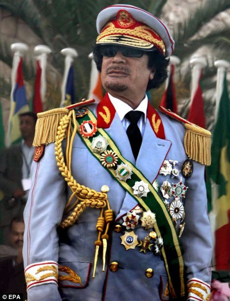 Heavily decorated: Gaddafi pictured in an ostentatious military uniform in 2009, watching a parade to mark the 40th Anniversary of the Libyan Revolution African History, African Dictators, Ventriloquist Doll, Muammar Gaddafi, African Royalty, Shocking News, Great Leaders, Libya, Military Uniform