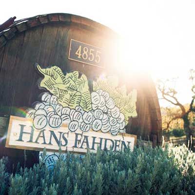 The third generation of the Fahden Family produces Cabernet Sauvignon at their vineyards stretching over 100 acres in Calistoga. The winery is known for the distinctive wine barrel sign at the road and is an incredibly romantic backdrop for weddings. Wine Barrel Signs, Margaret River Wineries, Malbec Wine, Napa Valley California, Napa Valley Wineries, Wine Cave, Pinot Noir Wine, Wine Tasting Experience, Romantic Backdrop