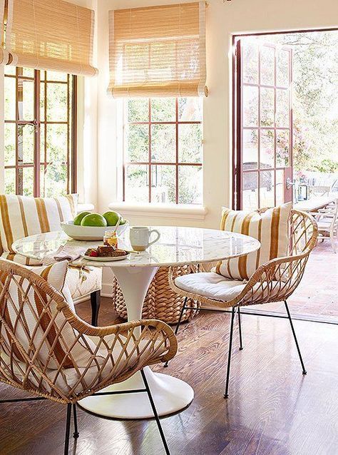 Breakfast nook dining room decor with Saarinen table and rattan Midcentury modern dining chairs. Natural rollup shades, wood floor, and happy chic in this California Spanish hacienda house featured in HOME AGAIN starring Reese Witherspoon. #diningroom #breakfastnook #homeagain #saarinen #California #interiordesign Small Kitchens, Tulip Table, Home Again, Victorian House, Furniture Layout, Trendy Home, Wicker Furniture, Modern Dining Room, Dining Room Design