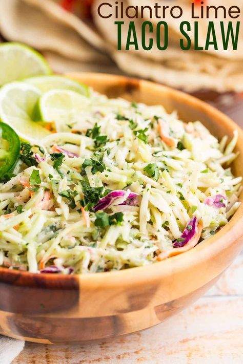 This refreshing Taco Slaw brings a zesty kick to any meal! With Greek yogurt, lime, and jalapeño, it’s a great addition to tacos, burgers, or BBQ. Quick, no-cook, and naturally gluten-free, it’s a simple yet delicious side dish. Jalapeno Cilantro Coleslaw, Bbq Tacos With Slaw, Jalapeno Slaw For Tacos, Asian Taco Slaw, Avocado Cabbage Slaw, Home Made Coleslaw Dressing Slaw Recipes, Mexican Coleslaw Recipe For Tacos, Lime Slaw For Fish Tacos, Cabbage For Tacos Slaw Recipes