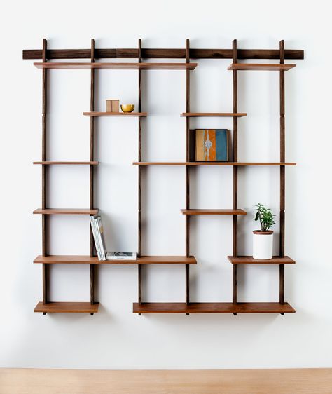 The Sticotti bookshelf is an ingenious, one-of-a-kind wooden modular shelving system that hangs from a single wall-mounted bracket. The shelves join together with a precise interlocking system and can be customized to fit any space by combining bracket systems and adding more shelves, making the possibilities endless. Decor Kitchen Ideas, Modular Shelving System, Ipe Wood, Modular Shelving, Shop Storage, Shelving Systems, Book Shelf, Design Kitchen, In Kitchen