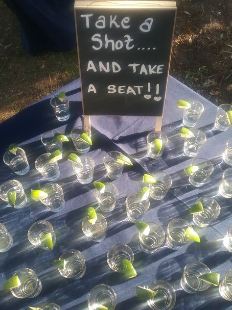 Shot Station Party, Shots For Wedding Guests, Welcome Shots Ideas, Entrance Fee Shots, Tequila Shot Wall Wedding, Entry Fee One Shot Sign, Take A Shot Take A Seat, Take A Shot And Take A Seat, Wedding Tequila Shots Wall